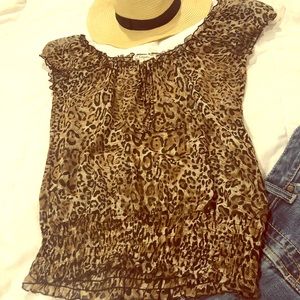 Cute slightly sheer leopard print top. Medium